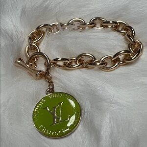 Gold Tone Bracelet with Authentic Chartreuse Green LV Charm.